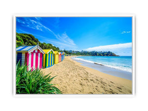 Beach Huts Along The Shore Framed Print