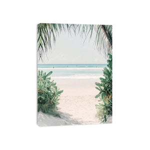 Tropical beach artwork with palm leaves for serene coastal bedroom decor