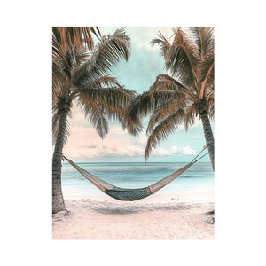 Hammock between palm trees overlooking ocean for peaceful coastal bedroom decor