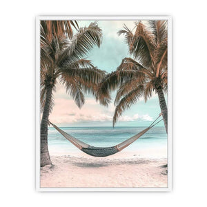 Hammock between palm trees overlooking ocean for peaceful coastal bedroom decor