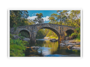 Stone River Crossing a rustic stone bridge spanning a calm river in sunlit woodland