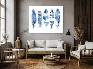 Blue watercolor feather wall art with delicate patterns for coastal bedroom decor.