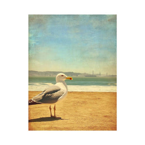Vintage seagull beach wall art with ocean and sand for coastal living room decor.