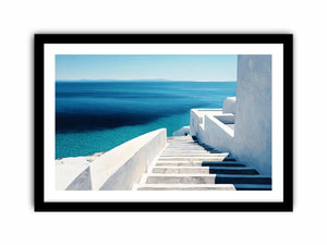 Mediterranean white stairs and turquoise sea canvas art for coastal living room decor.