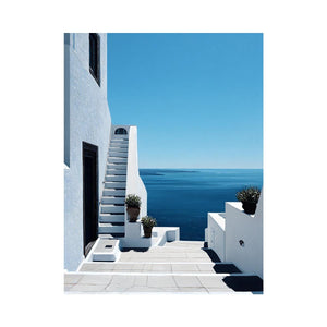 Greek courtyard stairs and sea photography for Mediterranean entryway decor.