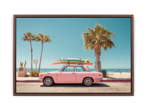 Pink vintage beach car with surfboards and palm trees for retro coastal wall decor.