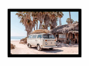 Cream vintage surf van near a palm beach hut for rustic coastal living room decor.