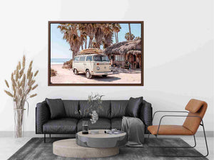 Cream vintage surf van near a palm beach hut for rustic coastal living room decor.