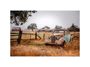 Weathered vintage car and rustic farm canvas art for farmhouse living room decor.