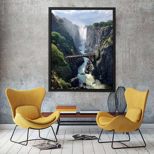 Vertical waterfall canyon photography print with bridge for dramatic entryway wall decor.