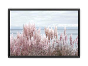 Soft blush pampas grass by the ocean as coastal botanical wall art for a serene bedroom.