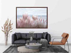 Soft blush pampas grass by the ocean as coastal botanical wall art for a serene bedroom.