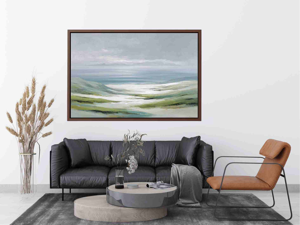 Soft misty coastal landscape canvas art with green hills and pale water for a refined living room.