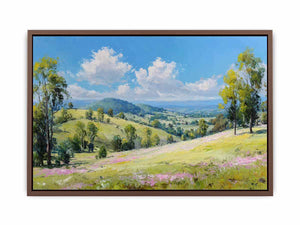Bright green countryside landscape canvas art with mountains and clouds for peaceful home decor.