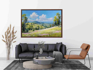 Bright green countryside landscape canvas art with mountains and clouds for peaceful home decor.