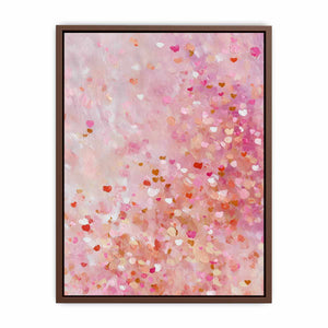 Soft pink abstract canvas art with heart-like confetti marks for bedroom or nursery decor.
