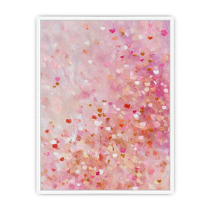 Soft pink abstract canvas art with heart-like confetti marks for bedroom or nursery decor.