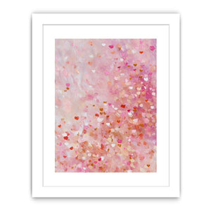 Soft pink abstract canvas art with heart-like confetti marks for bedroom or nursery decor.