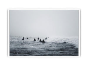 Moody surf canvas art with surfers and misty ocean waves for modern office decor.