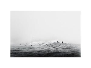 Surfers waiting on ocean waves artwork for coastal living room decor