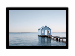 Blue boathouse over water artwork for coastal living room decor