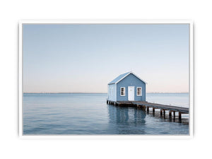 Blue boathouse over water artwork for coastal living room decor