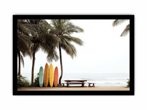 Colorful surfboards and palm trees overlooking the ocean for coastal wall decor