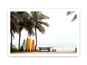 Colorful surfboards and palm trees overlooking the ocean for coastal wall decor