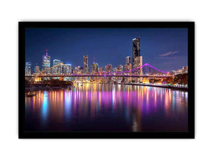 Illuminated bridge and city skyline canvas art for contemporary living room decor.
