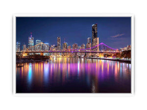Illuminated bridge and city skyline canvas art for contemporary living room decor.