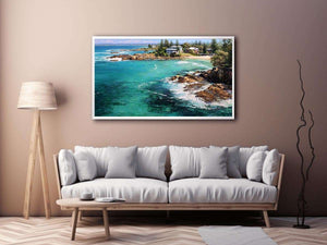 Turquoise coastal cove canvas art with rocky shoreline for modern living room decor.