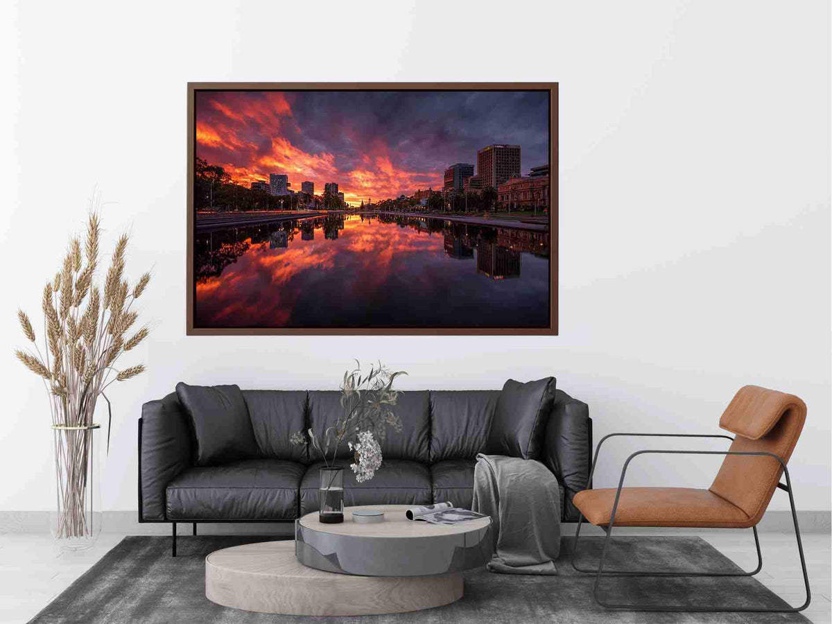 Dramatic city skyline canvas art with fiery sunset reflections for modern decor.