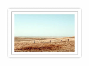 Prairie landscape photography with golden grass and fence for modern farmhouse decor