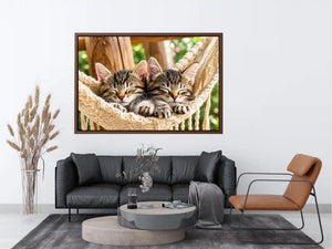 Bright cozy sleeping kitten wall art featuring two tabby cats resting in a woven hammock with soft natural daylight and neutral organic tones.