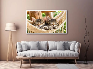 Bright cozy sleeping kitten wall art featuring two tabby cats resting in a woven hammock with soft natural daylight and neutral organic tones.