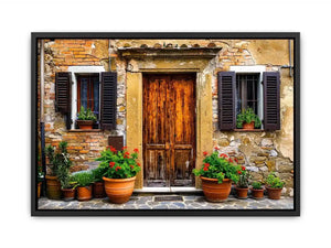 Bright rustic Mediterranean house facade wall art with vintage wooden doors, textured stone walls, and terracotta flower pots in airy natural daylight.