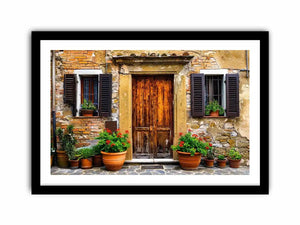 Bright rustic Mediterranean house facade wall art with vintage wooden doors, textured stone walls, and terracotta flower pots in airy natural daylight.
