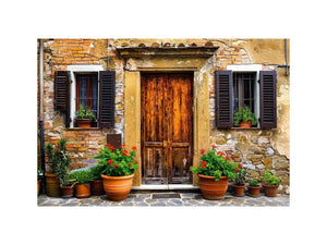 Bright rustic Mediterranean house facade wall art with vintage wooden doors, textured stone walls, and terracotta flower pots in airy natural daylight.