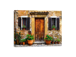 Bright rustic Mediterranean house facade wall art with vintage wooden doors, textured stone walls, and terracotta flower pots in airy natural daylight.