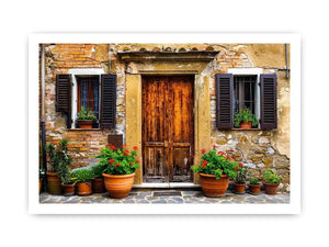 Bright rustic Mediterranean house facade wall art with vintage wooden doors, textured stone walls, and terracotta flower pots in airy natural daylight.