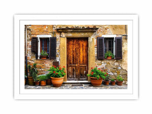 Bright rustic Mediterranean house facade wall art with vintage wooden doors, textured stone walls, and terracotta flower pots in airy natural daylight.