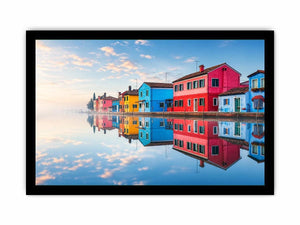 Bright colorful coastal village wall art featuring vibrant European houses reflected in calm water with soft fog and minimalist atmospheric tones.