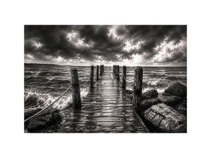 Black and white ocean pier wall art with dramatic coastal waves and minimalist nautical landscape aesthetic