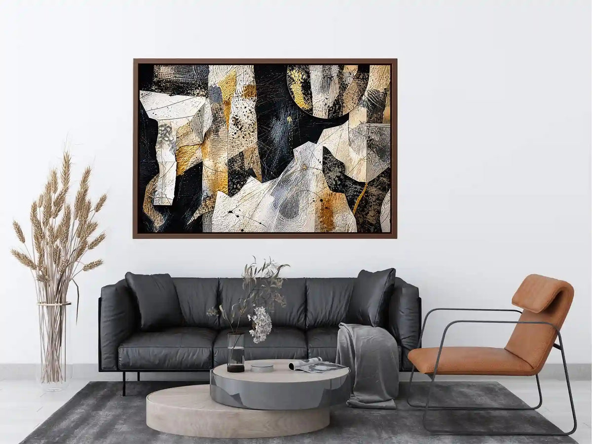 Abstract collage artwork with black, white, and gold textures and layered paper elements