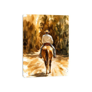 Rustic watercolor cowboy riding horse through earthy western landscape wall art