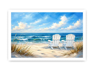 White beach chairs overlooking calm ocean waves on a sandy coastal shoreline