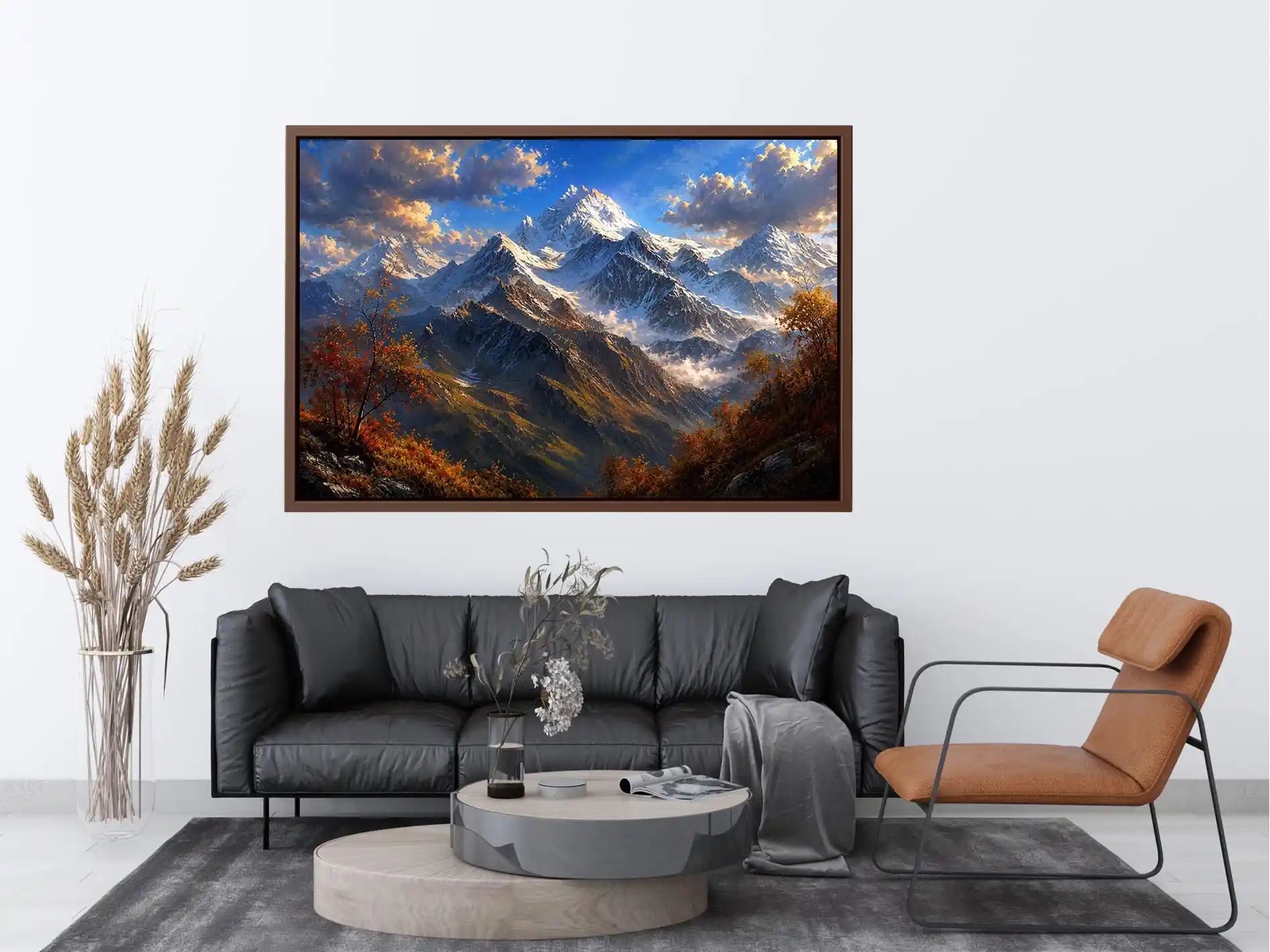 Majestic snow-covered mountain peaks with autumn trees beneath a dramatic blue sky