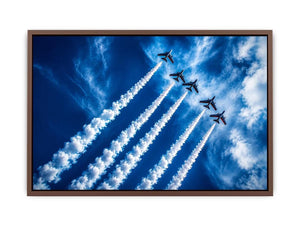 Modern aviation wall art featuring jet planes flying in formation with dramatic smoke trails across deep blue sky in dynamic photography style