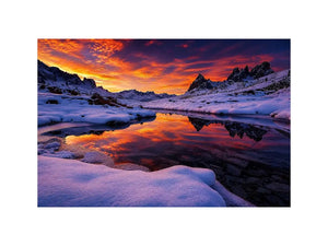 Snowy mountain sunset wall art with frozen lake reflection, colorful twilight sky and peaceful winter landscape photography.