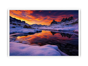 Snowy mountain sunset wall art with frozen lake reflection, colorful twilight sky and peaceful winter landscape photography.